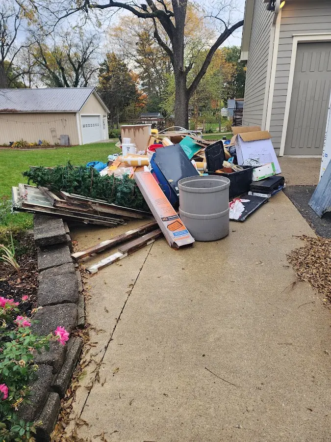 Dumpster being loaded with debris for Residential Dumpster Rental in Dalton